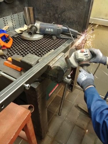 “Cleaning the surfaces before welding.